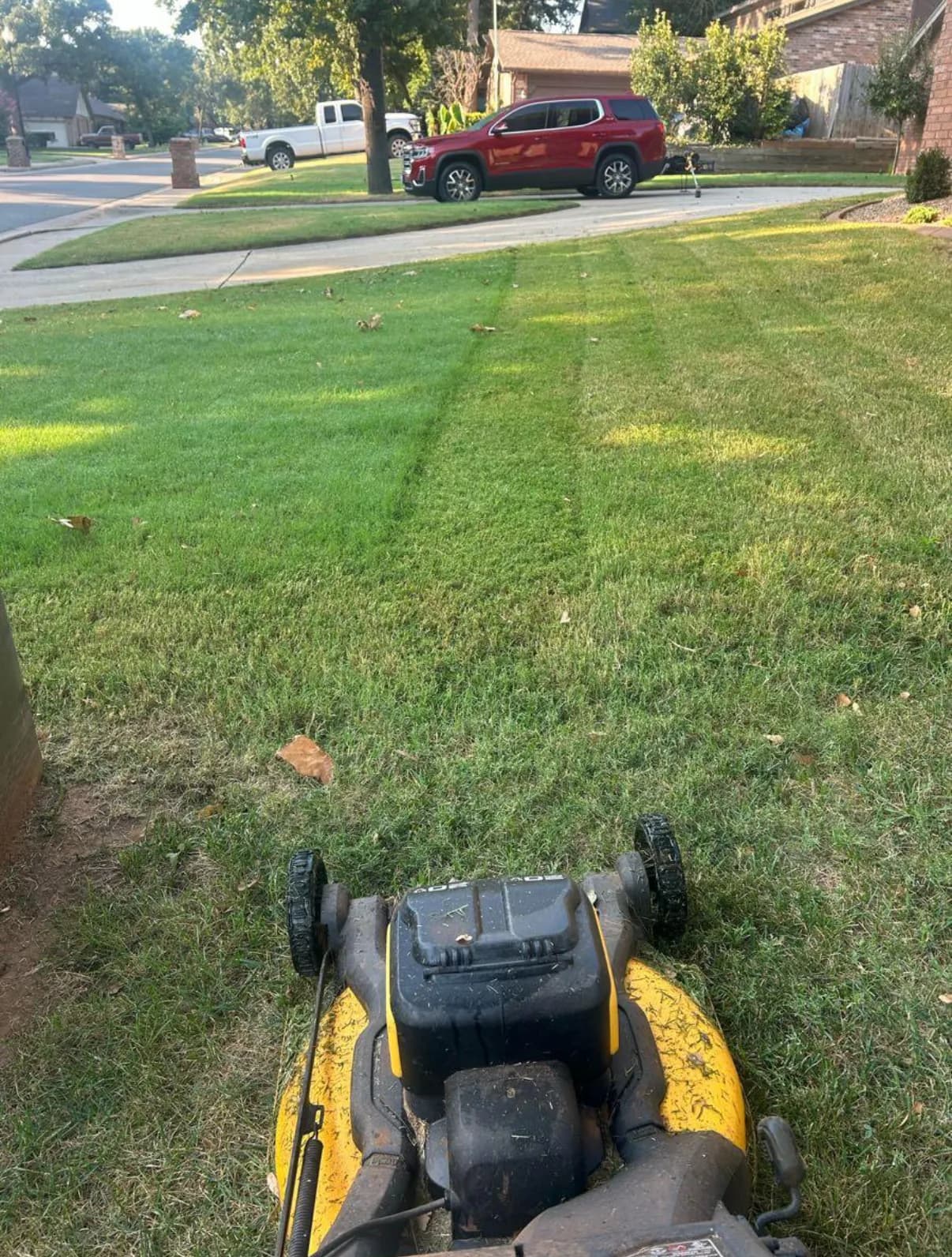 Mowing a residential lawn, seen from the mower.